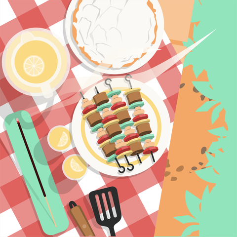 Overhead illustrated view of a table covered in a checkered table cloth next to grasses and flowers. On the table there is a plate of kabobs, a coconut cream pie, a pitcher of lemonade with a few glasses, some BBQ utensils, and an incense stick burning in a long incense holder.