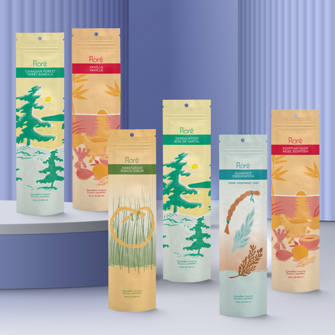 Six different packages of incense sticks standing upright against a purple background. From left to right the packages include Canadian Forest, Vanilla, Sweetgrass, Sandalwood, Guidance and Egyptian Musk.