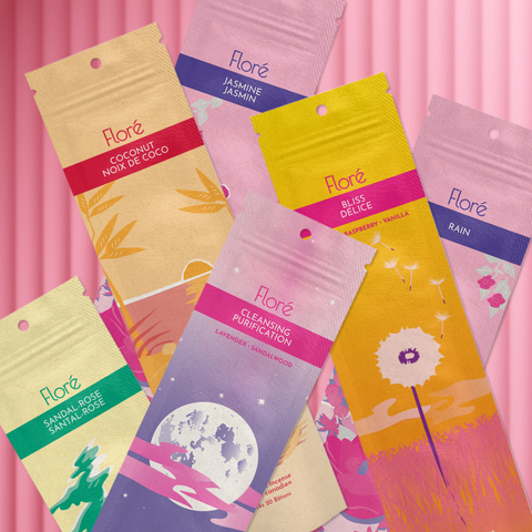 Six different packages of incense sticks lay askew on a hot pink background. The packages are Sandal-Rose, Cleansing, Coconut, Rose, Bliss, and Jasmine.