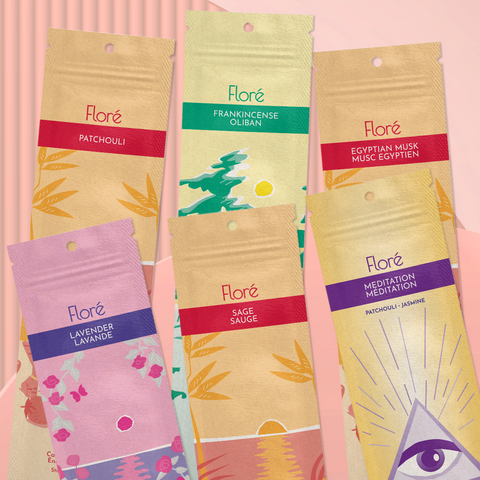 Six different packages of incense sticks arranged in two rows against a pale peach background. The back row includes Patchouli, Frankincense and Egyptian Musk, and the front row includes Lavender, Sage and Meditation.