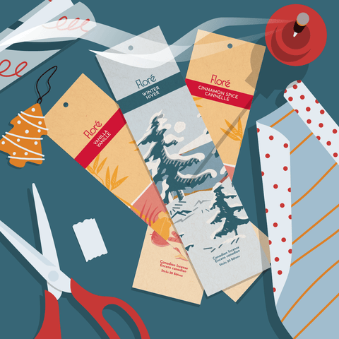 An illustrated overhead view of Flore Canadian Incense's Winter, Vanilla and Cinnamon Spice incense sticks surrounded by gift wrapping items.