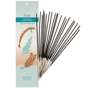 Image of 1 package of Flore Canadian Incense Guidance fragrance, featuring a braid of sweetgrass, a bow of cedar and a sprig of sage. There are 20 incense sticks splayed beside it as every package contains 20 incense sticks. Scent notes displayed are cedar, sweetgrass, sage.