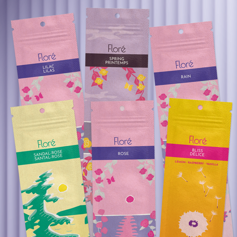 Six different packages of incense sticks lay in two rows against a golden yellow background. The back row includes Lilac, Spring and Rain, and the front row includes Sandal-Rose, Rose and Bliss. 