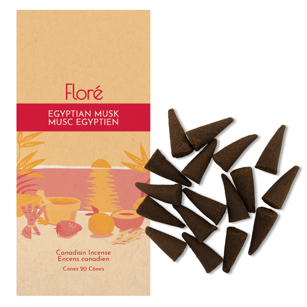 Image of Flore Canadian Incense Egyptian Musk package, featuring a strawberry, orange, cinnamon stick, mortar and pestle on a warm beach. There are 20 incense cones splayed beside it as every package contains 20 incense
